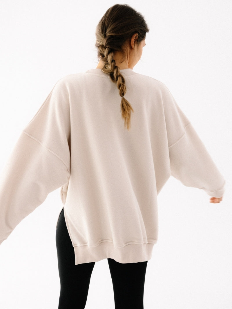 Kremowa luźna bluza bawełniana - widok na plecy