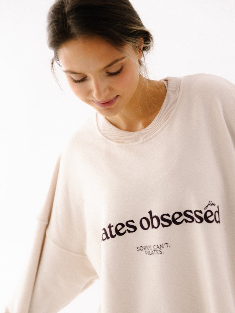 Luźna bawełniana bluza oversize Kind w kremowym kolorze z nadrukiem pilates obsessed